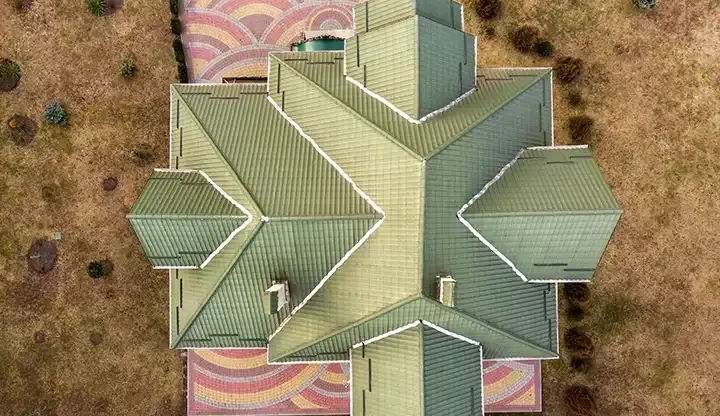 North Texas home roof with visible storm and hail damage after a severe weather event