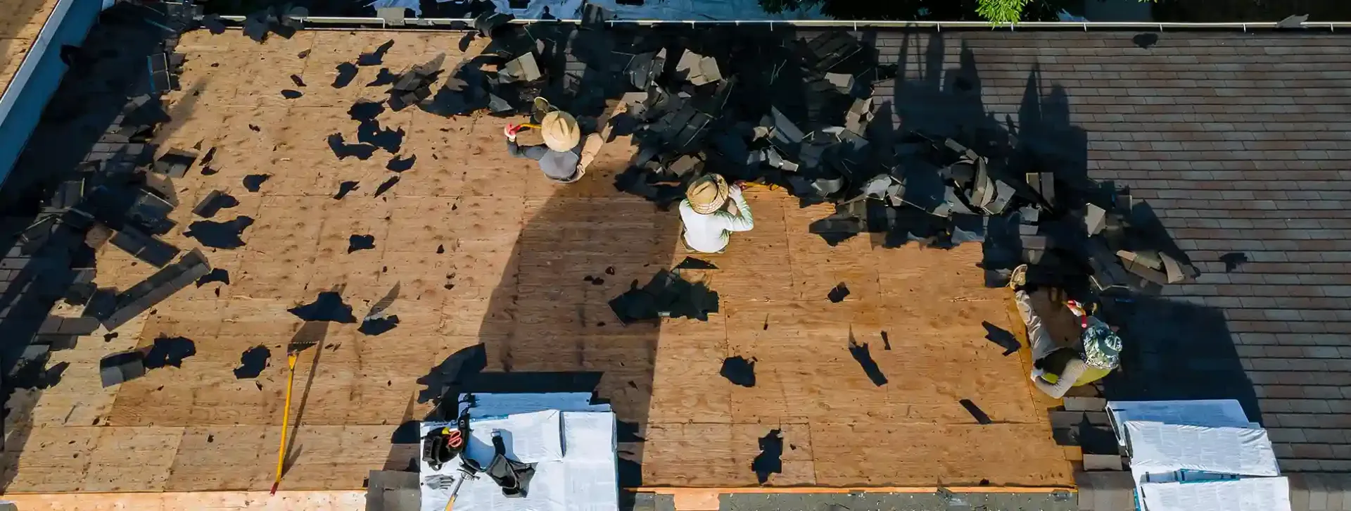 Roofing professional performing a detailed inspection on a North Texas home